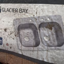 Stainless steelDouble bowl sink. 22” W X 38” L X 8” Deep