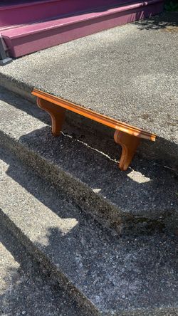 Medium maple colored wall shelf