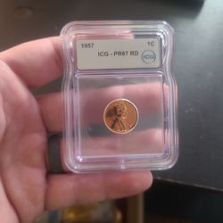 This is a 1957 Lincoln Wheat Cent, graded by ICG as Proof 67 Red (PR67 RD). 