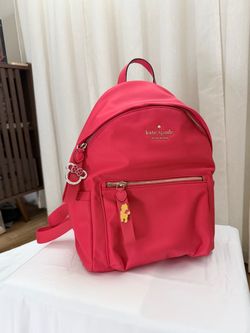 Kate spade Red backpack w/ 2 Disney pins