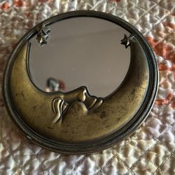 Crescent moon mirror with starburst