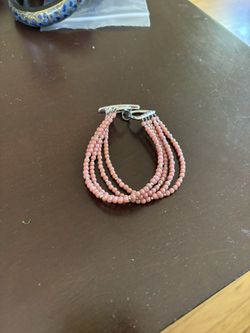 beautiful rose/pink triple strand beaded bracelet