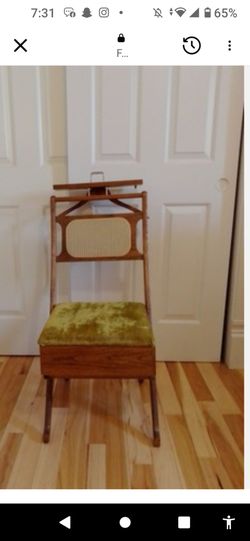 This is a mid-century modern valet chair

(sometimes called a gentleman's valet or butler chair). Made by Setwell