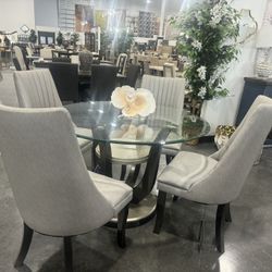 5 Pieces: Dining  Set . Includes: Round glass table and 4 chairs. 
