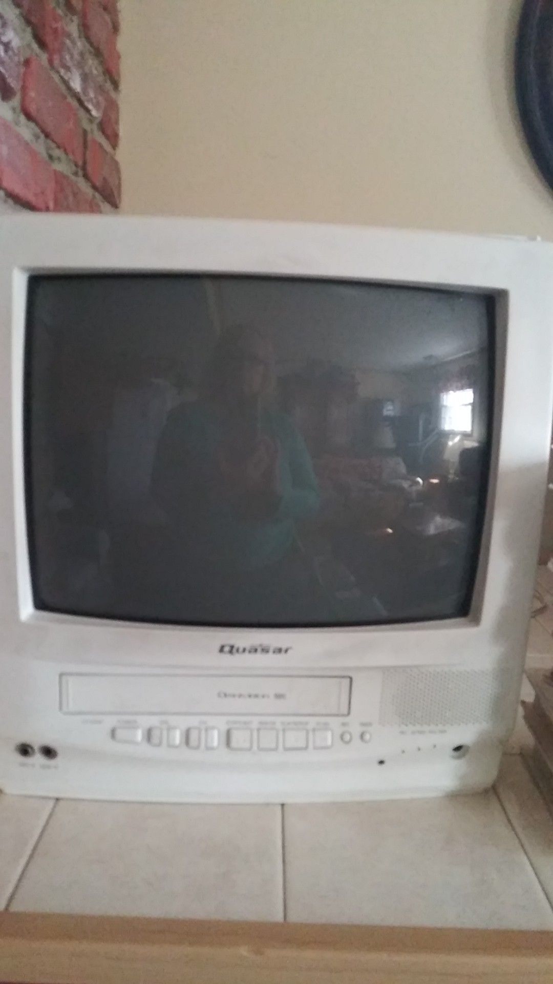 Quasar tv...vcr. Works great! Comes with 8 Disney movies