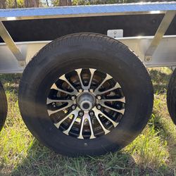 New 235-80-16inch trailer tires with 8-lug black mags.  3500lbs