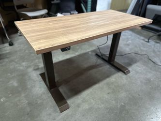 Kimball Intl sit to stand electric table 23” x 47” wood grain laminate top and brown frame, brand new table