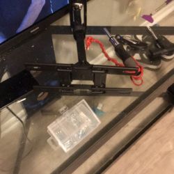 Tv Mount, 32 Inch Roku Phillips Smart Tv, Glass Tv Stand, Dancing Ceiling Lights. 