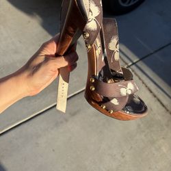 Gucci Brown Floral design with Wooden Heel and straps.