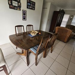 Wooden Table With 4 Chairs. 5th Chair Availble. Photographed.