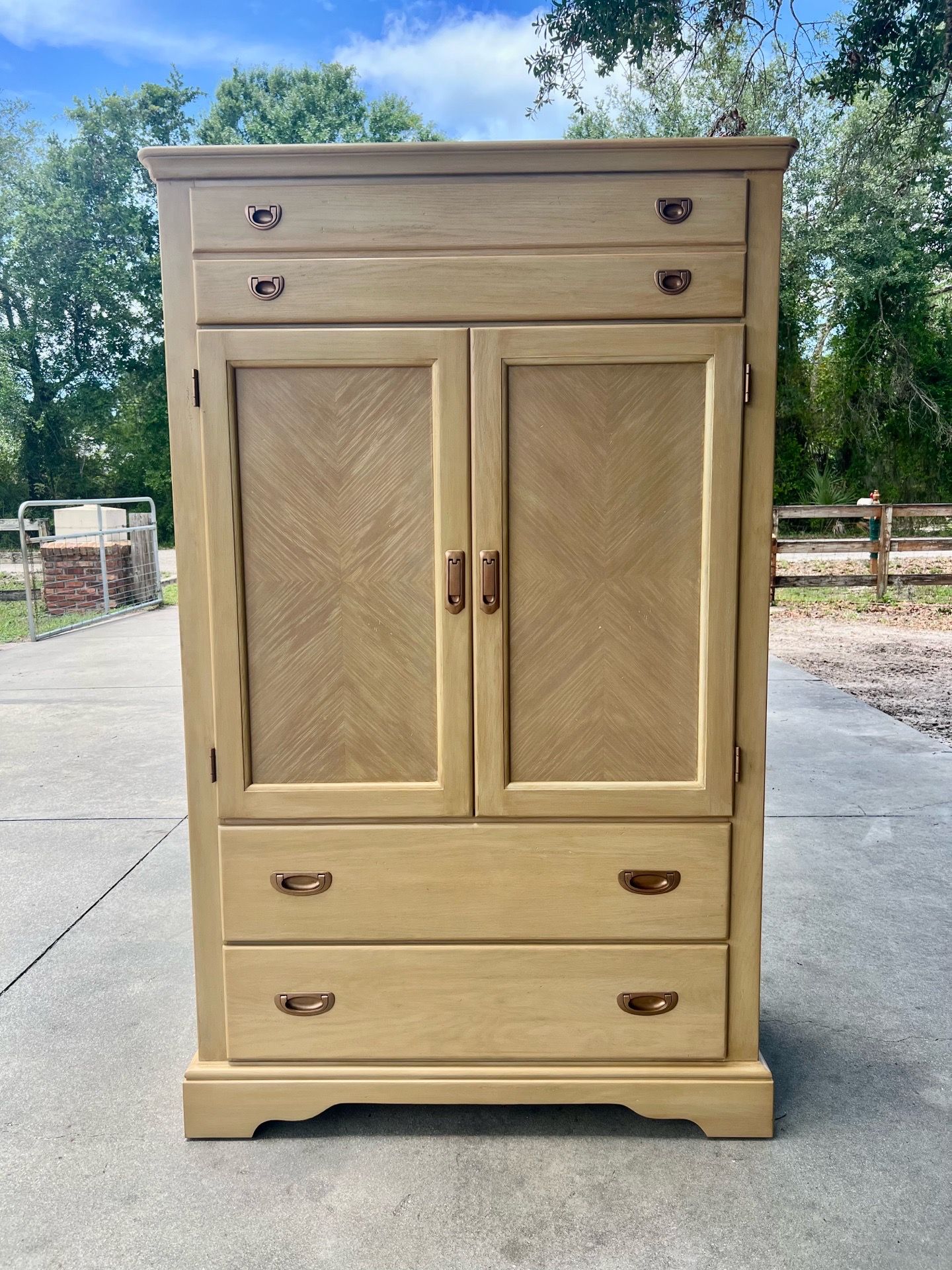 Coastal warm wood armoire cabinet