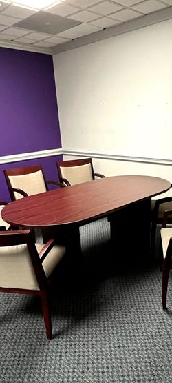 Beautiful Oval cherry jacaranda type conference, dinning , or office table