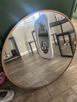 Gold round mirror