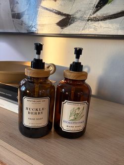 2 Empty amber dispensers for hand soap