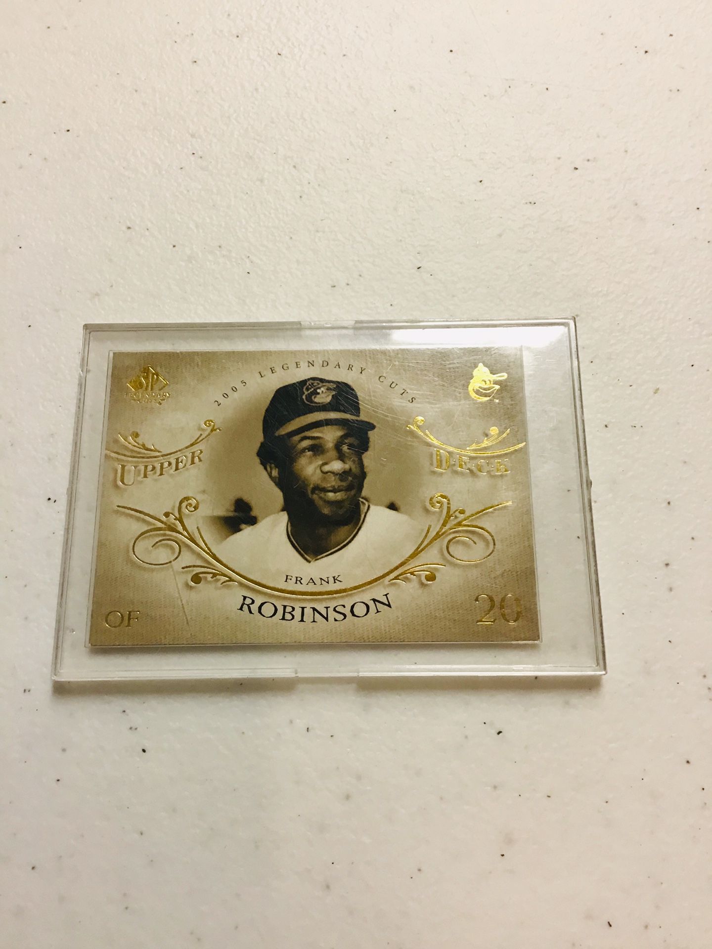 Frank Robinson baseball card in a thick project case