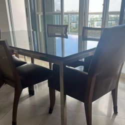 Black mirror table with chairs. 