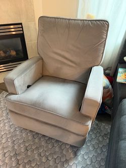 Grey swivel rocking chair