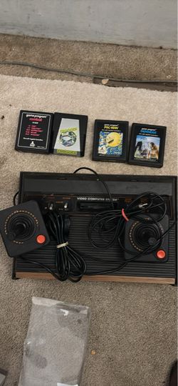 Atari 2600 Console with 2 Joysticks and 4 Games