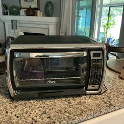 Oster Large Digital Countertop Convection Toaster Oven, Black & Stainless Steel.