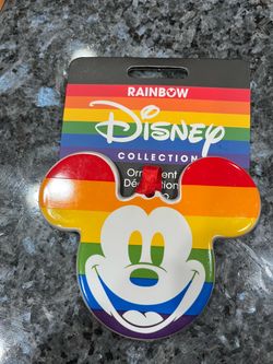 Disney Parks Mickey Mouse Pride Rainbow Ceramic Christmas Ornament. Size approximately 3 1/2 inches long and 4 1/4 inches wide. Brand new on origina