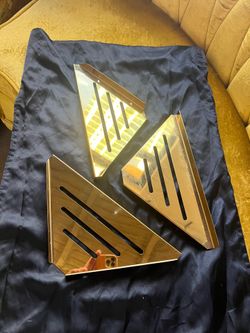 Beautiful gold corner shelves