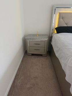 Queen bed with mattress and light, night table