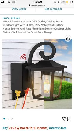 Outdoor light with GFCI outlet