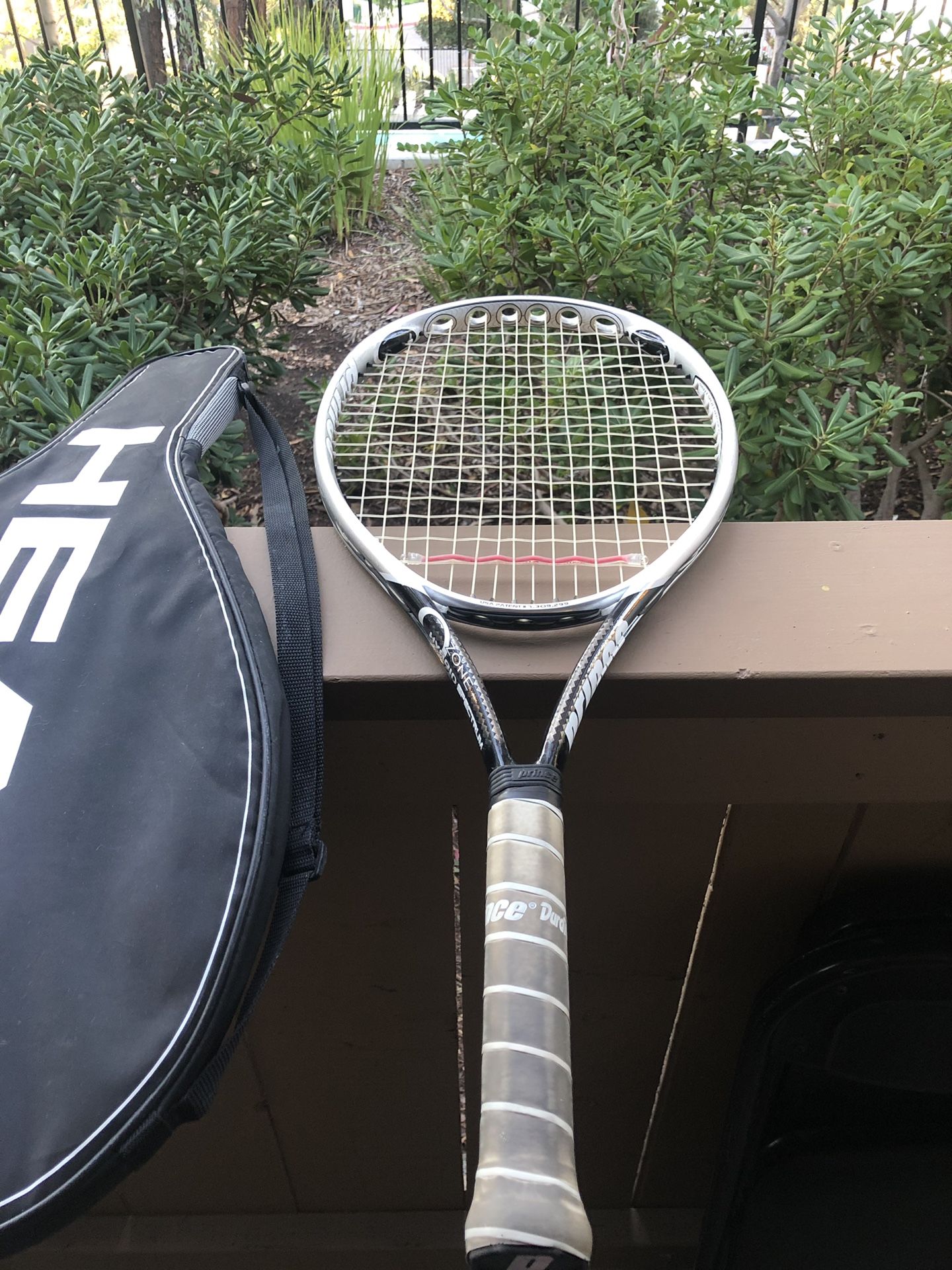 Two tennis rackets and single carrying case