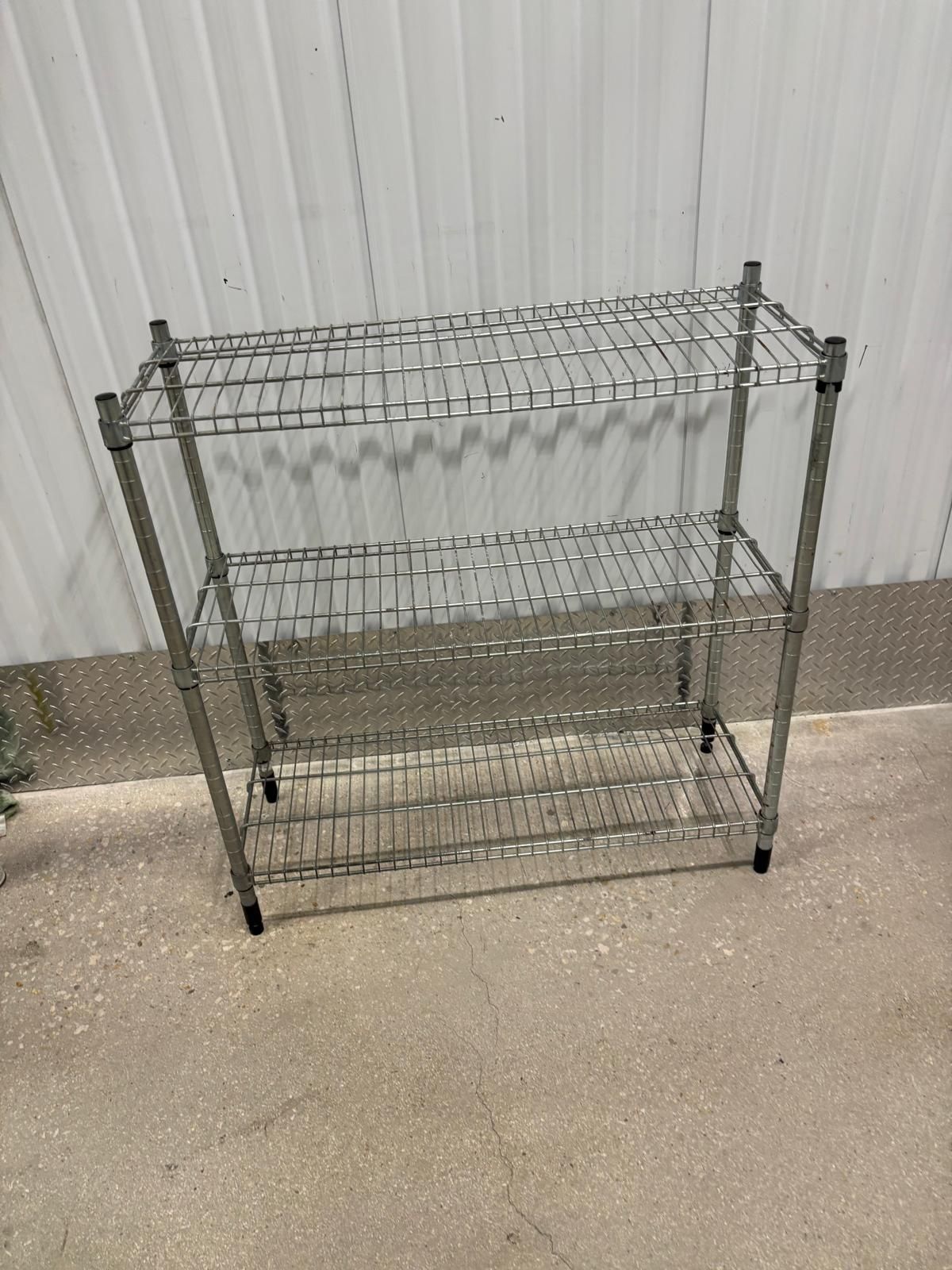 Three tiered metal rack … 36” wide , 14” depth , 36” high .. $45