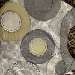 Kindly used Coach gray bag one minor flaw