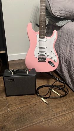 Pink Stratocaster electric guitar