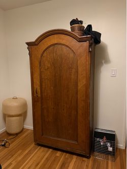 Solid wood vintage wardrobe armoire cabinet on wheels