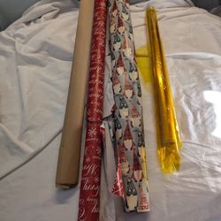 Opened Christmas Gift Wrapping Paper And Gift Boxes And Bags