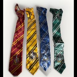 Lot of 4 Harry Potter Child Ties, Hufflepuff Griffindor Ravenclaw, Slytherin New, 13” neck length, 15” tall new with tags, the world of Harry Potter,