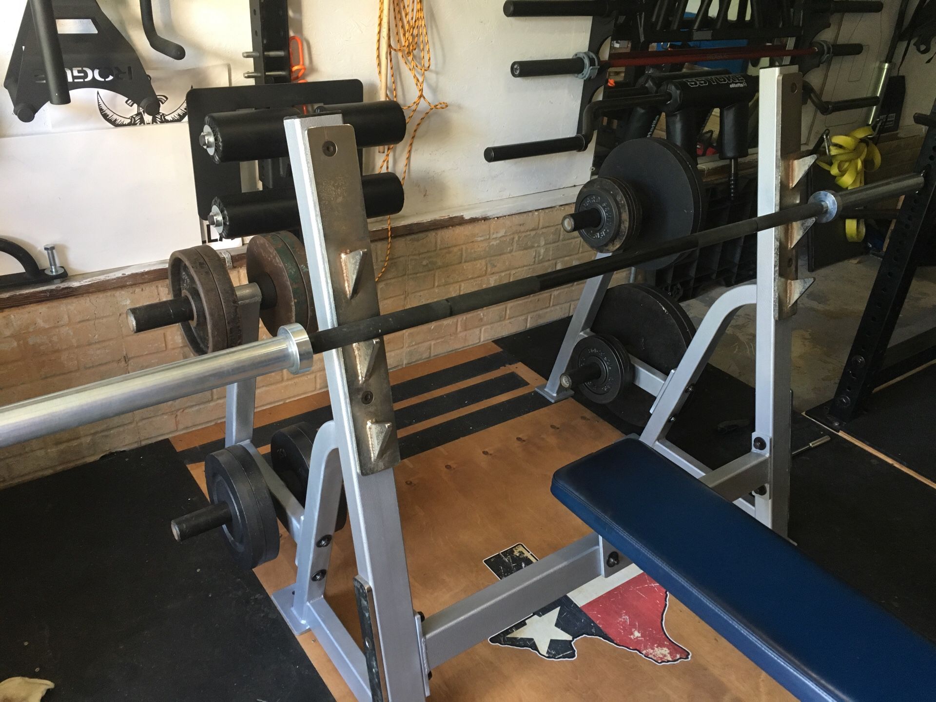 Hoist Olympic style Flat Bench press with Rogue Beater bar and weight