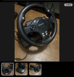 The DOYO GAMING RACING STEERING WHEEL WITH PEDALS.