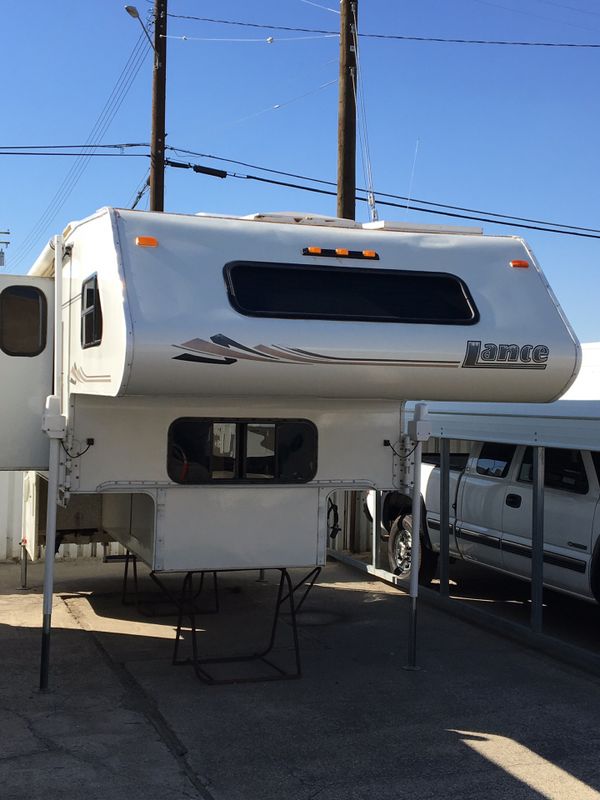Lance model 1120 cab over camper ,2003 .loaded remote electric jacks,3.