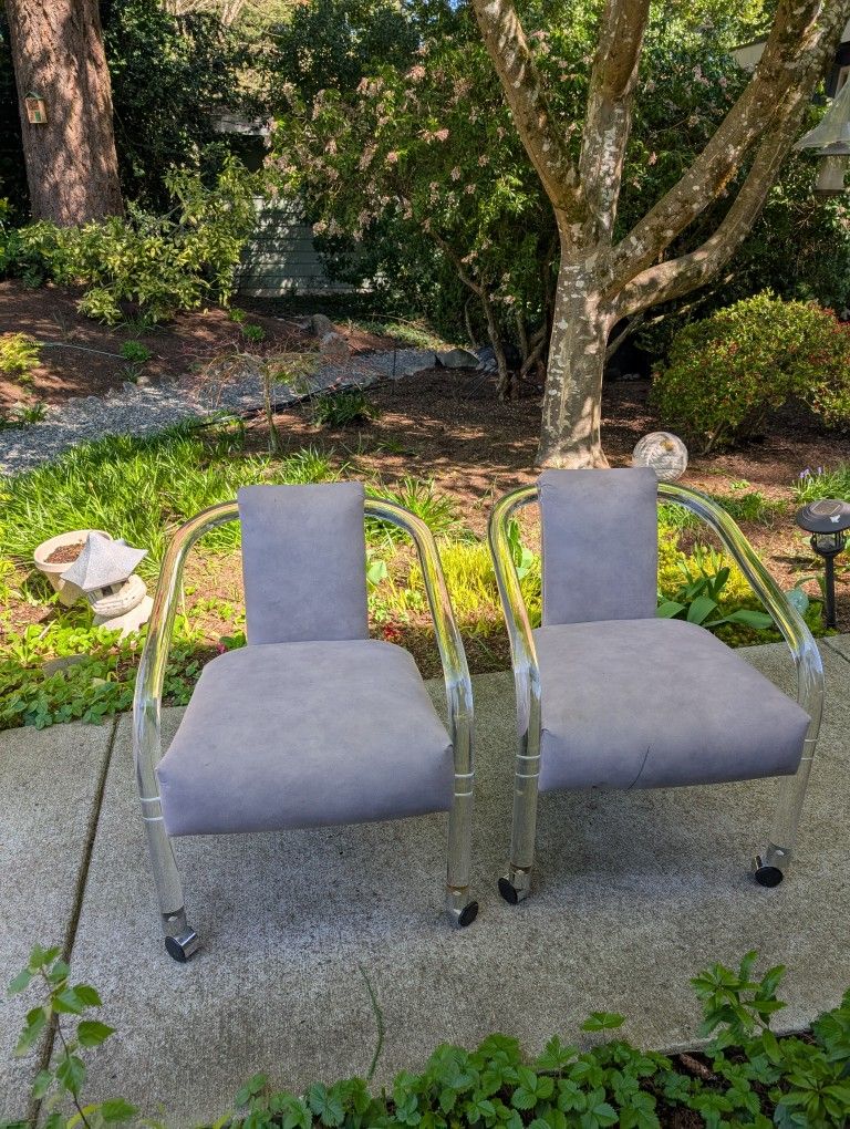 Two Lucite Rolling Chairs