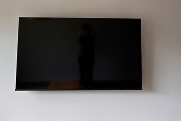 65” Hisense Smart TV with Full Motion Wall Mount