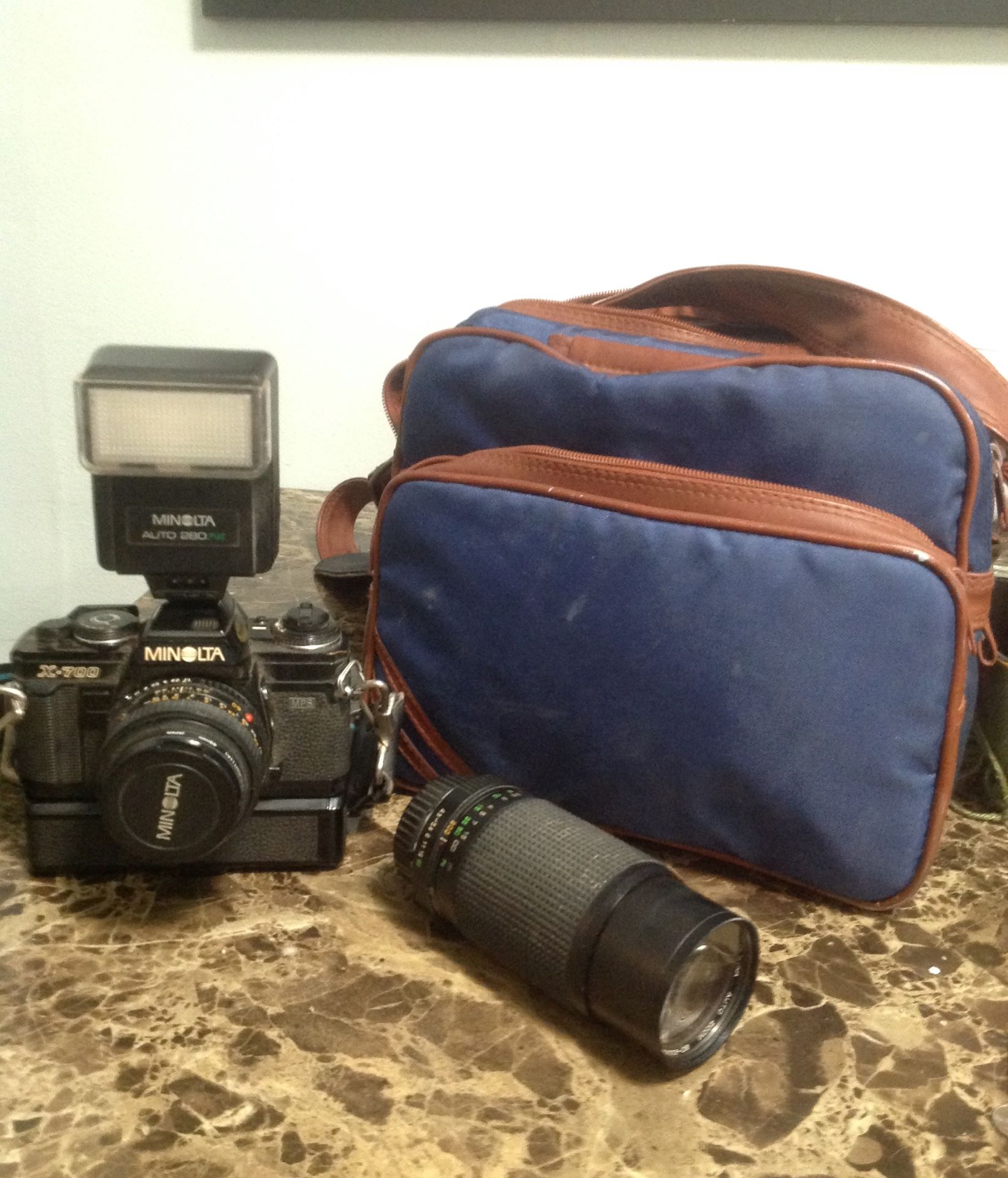 Minolta camera with carrying case, and accessories. I’ll even throw in a little cleaning kit.