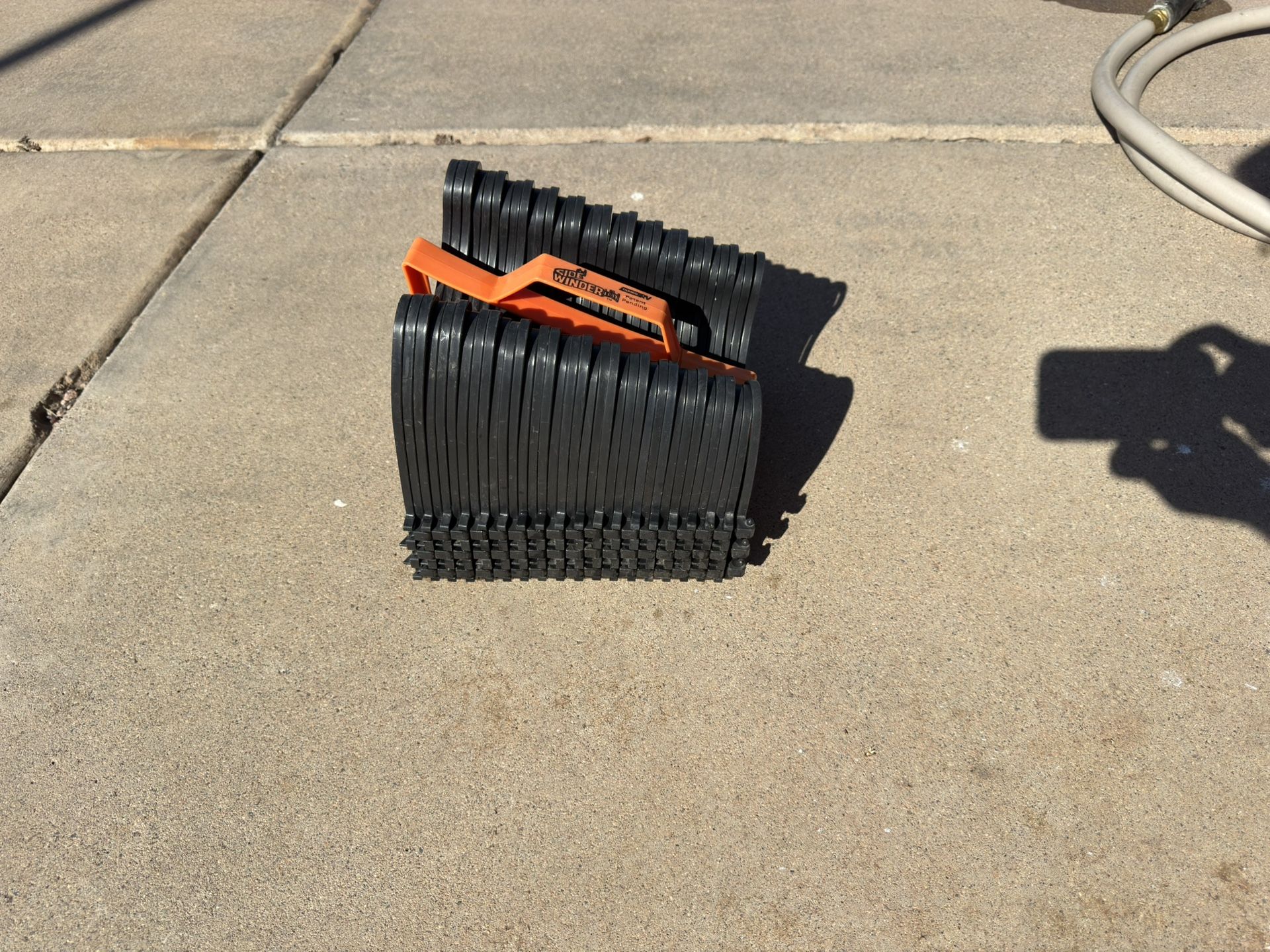 Sidewinder RV Sewer Hose Support