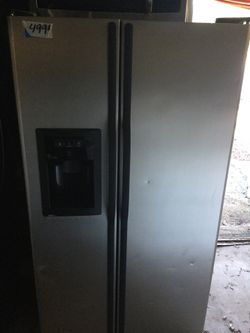 Black and stainless side by side refrigerator/ 90 day warranty/ delivery and installation are available