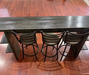 Bar height table with 3 bar stools