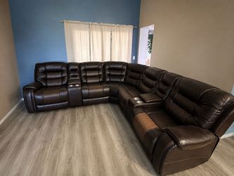 Sectional leather 3 recliners and middle console with usb charger and plugs