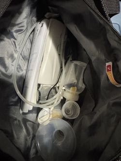 Ameda breast pump, with bag