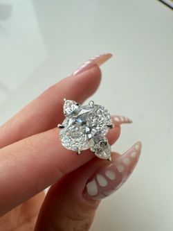 Oval Cut With Side Stones Ring
