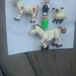 Vintage Fisher-Price police figures and vehicles.