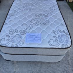 Twin Size Bed,  mattress with box spring and metal frame,  in good condition