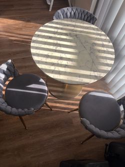 Dining Table with 3 Chairs( possibly 4)