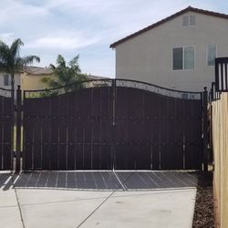 Steel Gates and fences with integrated rustic wooden planks any length and any size, and many styles
